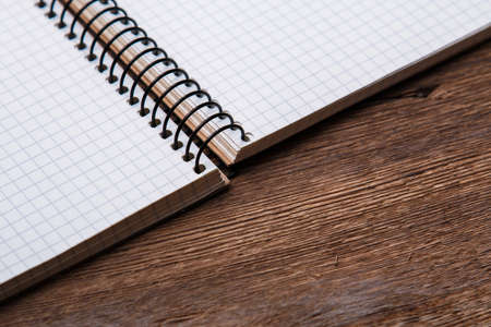 Empty notepad on wooden surfaceの写真素材