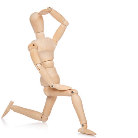 Small wooden dummy on white backgroundの写真素材