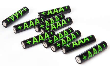Heap of AAA batteries on white backgroundの写真素材