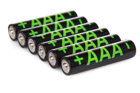 Heap of AAA batteries on white backgroundの写真素材