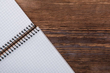 Empty notepad on wooden surfaceの写真素材