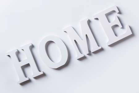 White letters with word HOME on white backgroundの写真素材