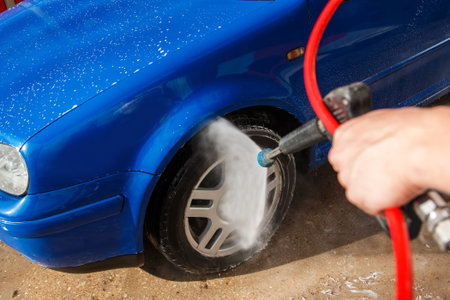 Modern blue car in a car wash