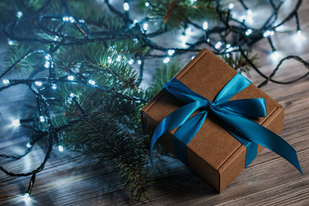Christmas background. Gift box and christmas lights