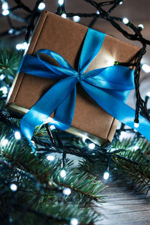 Christmas background. Gift box and christmas lightsの写真素材
