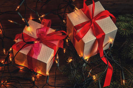 Christmas background. Gift boxes and christmas lightsの写真素材