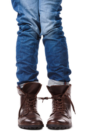 Tied legs in leather shoes on white background