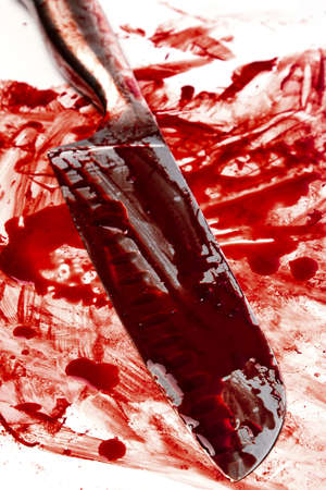 Knife in blood on white backgroundの写真素材