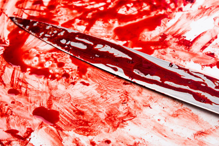 Knife in blood on white background