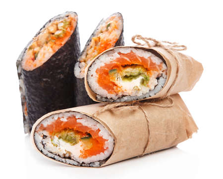 Sushi burrito - new trendy food concept. Sushi burrito rolls on white backgroundの写真素材