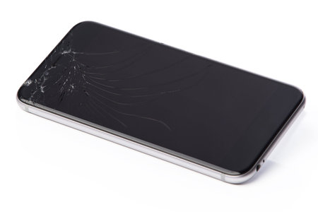 Smart phone with broken display on white background