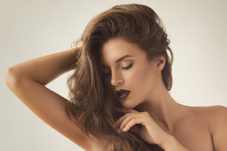 Portrait of beautiful woman with luxurious hair