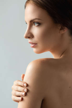 Beautiful woman with perfect face in natural lightの写真素材