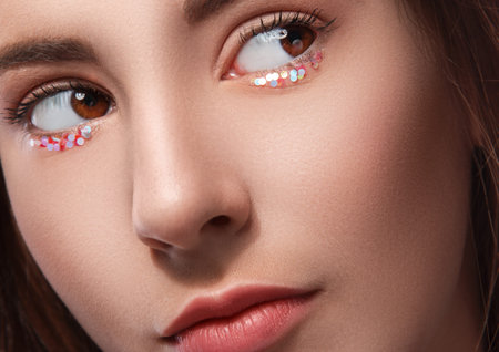 Close up picture of female eyes with artistic makeup