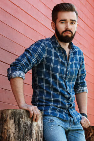 Handsome bearded man in checkered shirtの写真素材