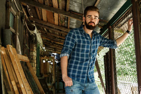 Handsome bearded man in checkered shirtの写真素材