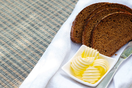 Slices of bread and butter on the table