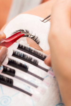 Procedure of eyelashes extension in salon
