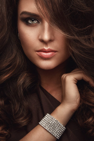 Portraif of beautiful woman with a shiny braceletの写真素材