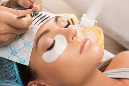 Procedure of eyelashes extension in salon