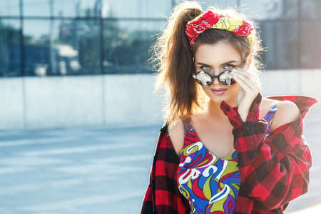 Beautiful and stylish girl on the streetの写真素材