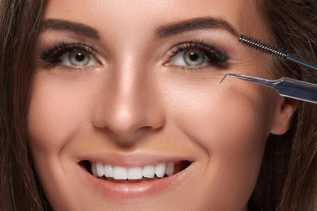 Beautiful woman with eyelash extension for maximum volume