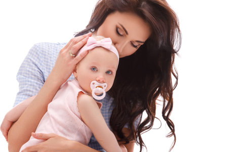Mother with her beautiful little daughter on white background