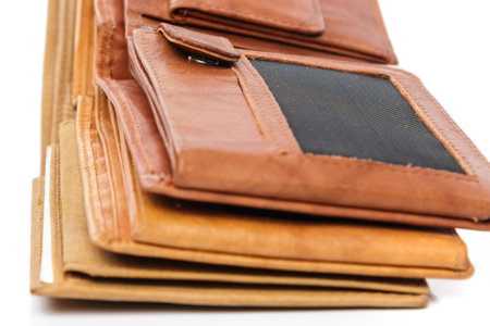 Different leather wallets on white background