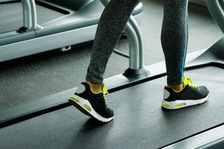 Close up of female legs on the treadmillの写真素材