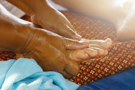 Close up of female feet during traditional Thai massageの写真素材