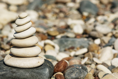 Stack of smooth round stones on the pebble beach