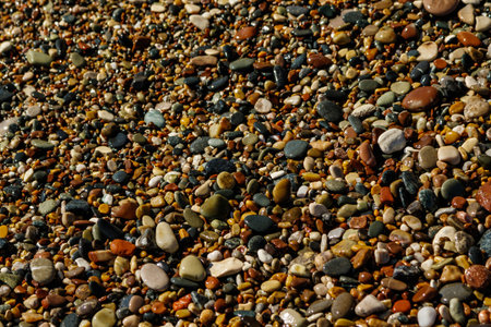 Close-up of smooth round pebble stones on the beach