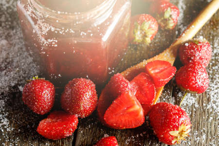 Homemade strawberry jam on wooden tableの写真素材