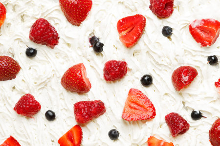 Strawberry, raspberry and blueberry in whipped cream