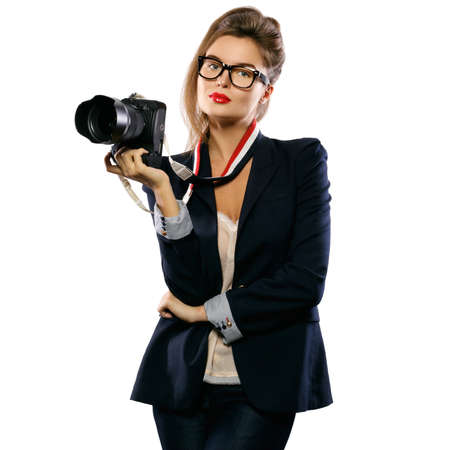 Woman photographer with a DSLR camera isolated on white backgroundの写真素材