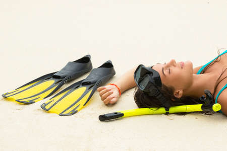 Young woman  with a mask for snorkeling. Summer and beach holidays.の写真素材