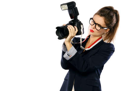 Woman photographer with a DSLR camera isolated on white backgroundの写真素材