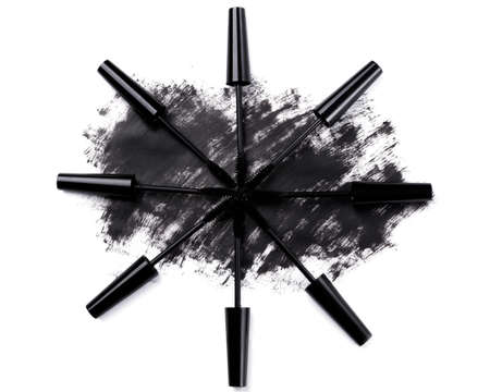 Brushes and smudged mascara on white backgroundの写真素材
