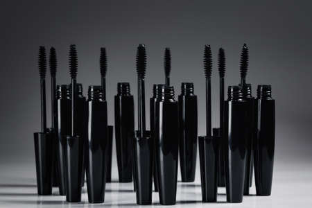 Mascara brushes and containers on white backgroundの写真素材