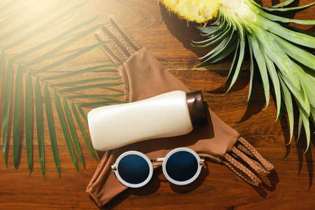 Summertime - Different items for beach vacations on wooden backgroundの写真素材