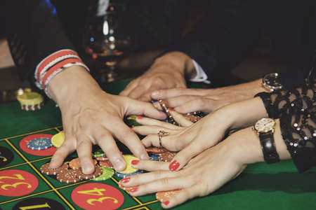 Different gands and casino chips.の写真素材