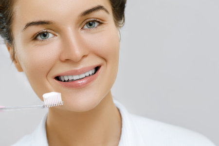 Woman cleaning her teeth in the bathroom
