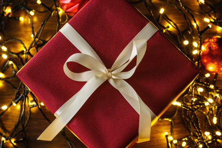 Background with a Christmas gifts and glowing lightsistmas lights
