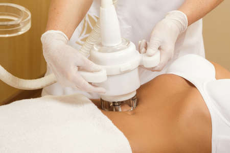 Woman during belly massage or figure correction procedureの写真素材