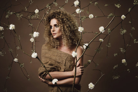 Portrait of lovely young woman with Afro hairstyle and beautiful make-up