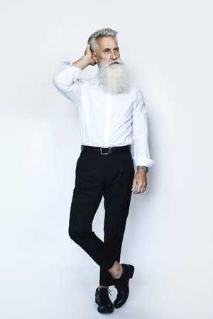 Handsome aged male model posing on white background