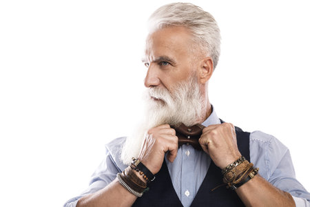 Handsome aged male model posing on white background