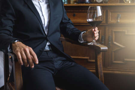 Man with a glass of red wineの写真素材