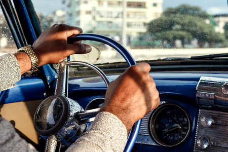 Drivers hands on the steering wheel of retro carの写真素材