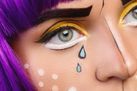 Model in creative image with pop art makeup